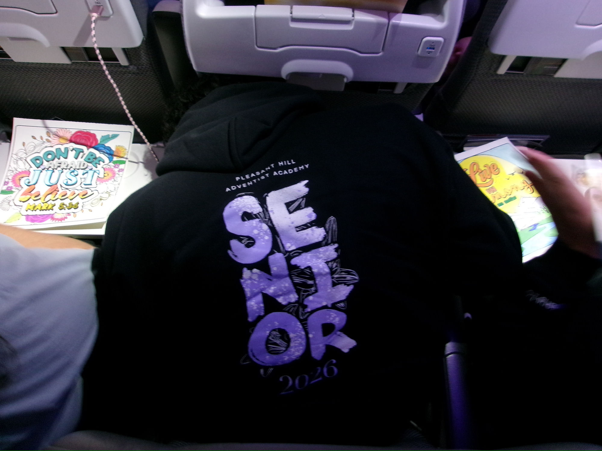 Senior hoodie on plane
