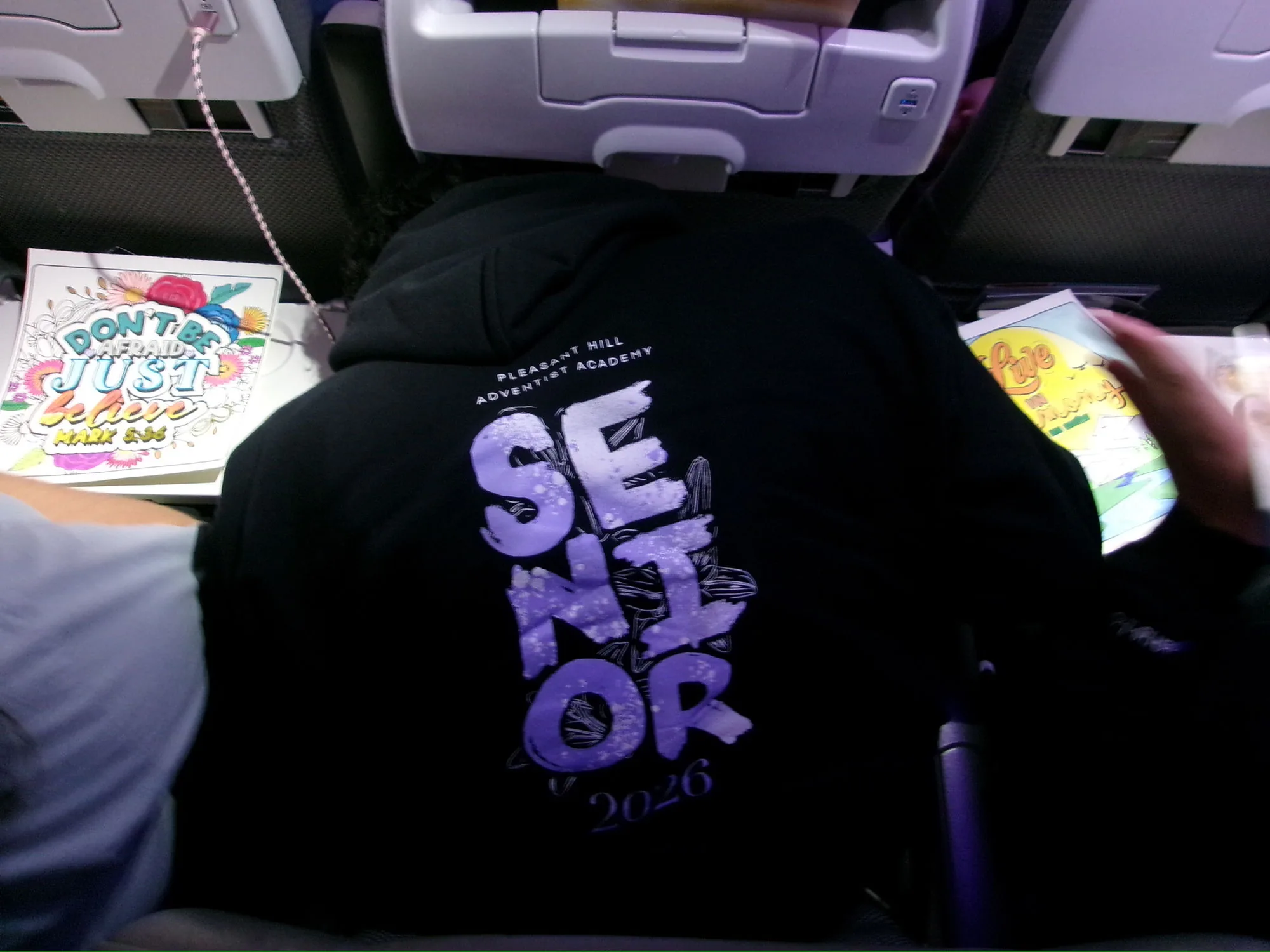 Senior hoodie on plane